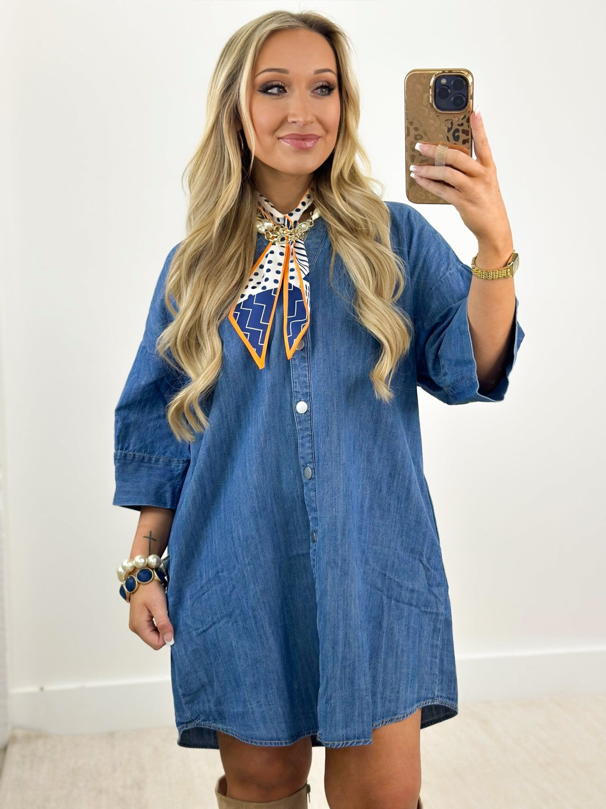 Button placket detail on a denim dress