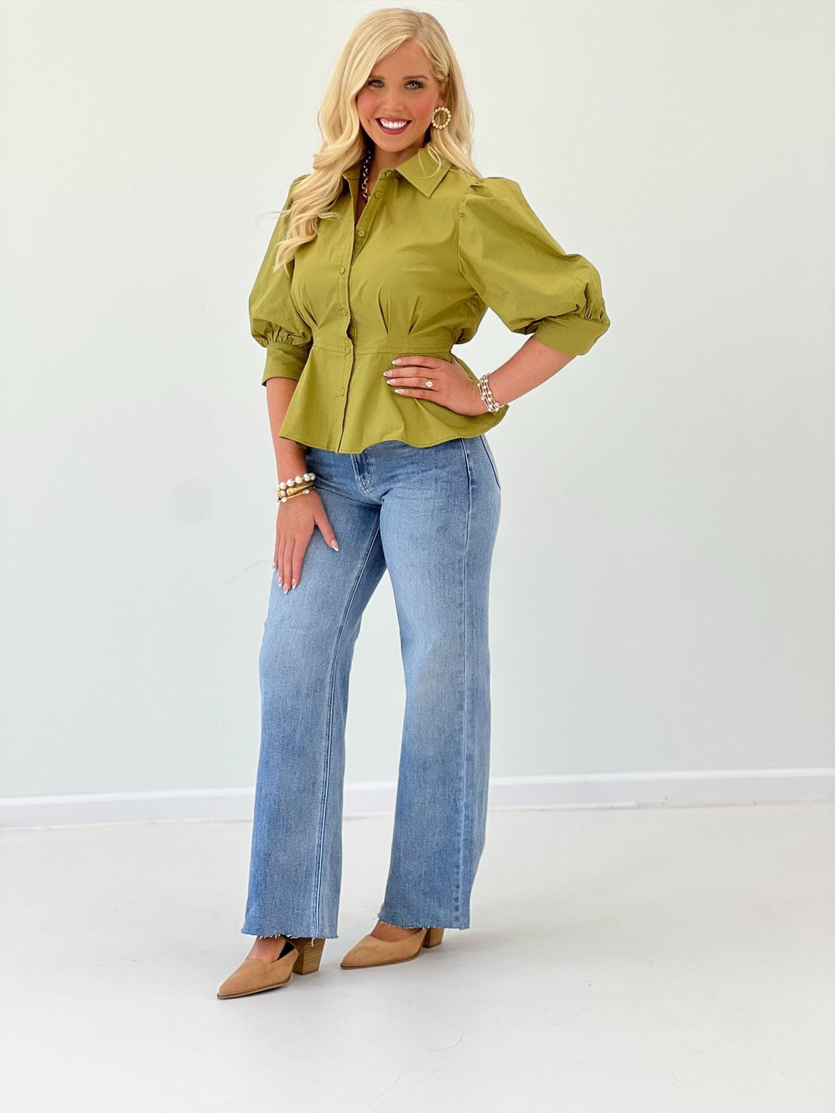 Peplum top in willow with a full button front
