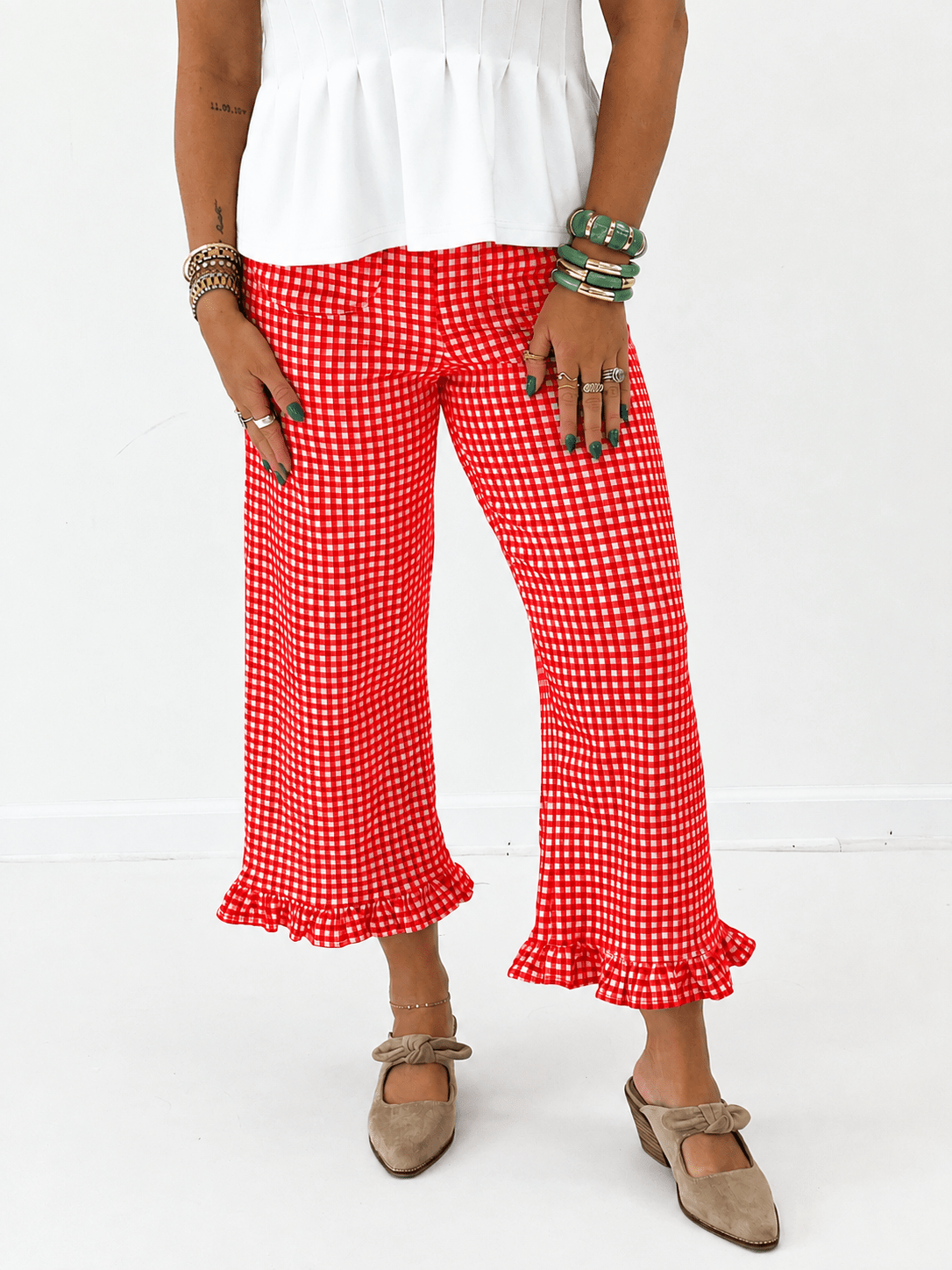 Gingham print pants with a ruffle trimmed ankle