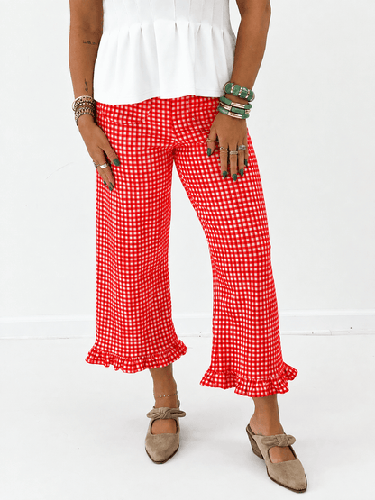 Gingham print pants with a ruffle trimmed ankle