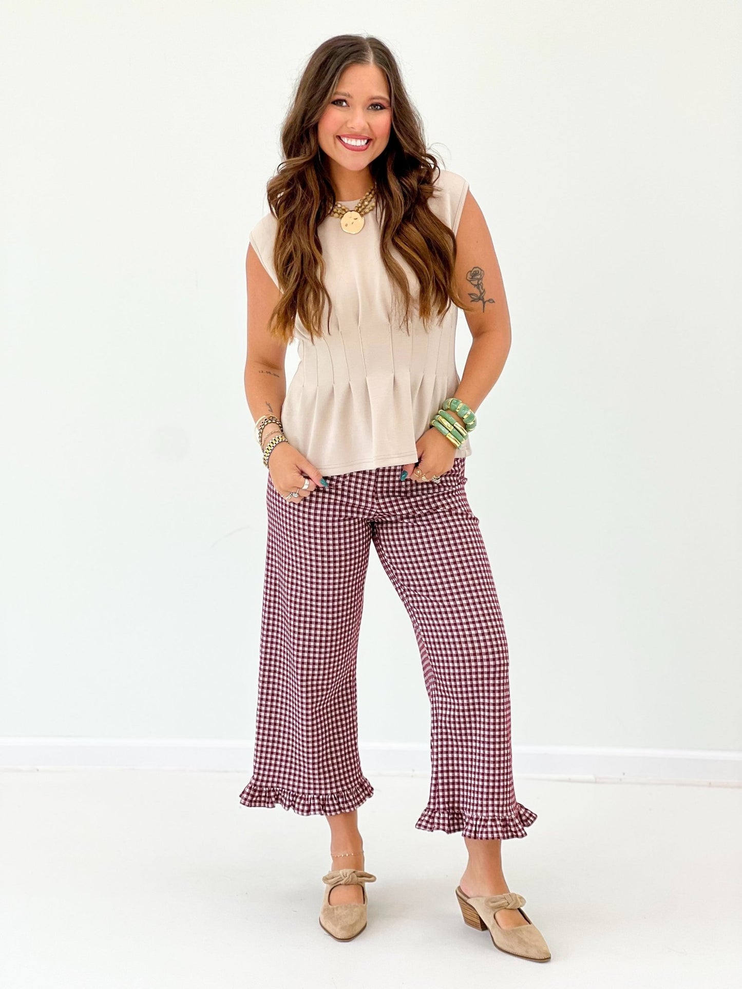 Gingham print pants with a flowing ruffled hem