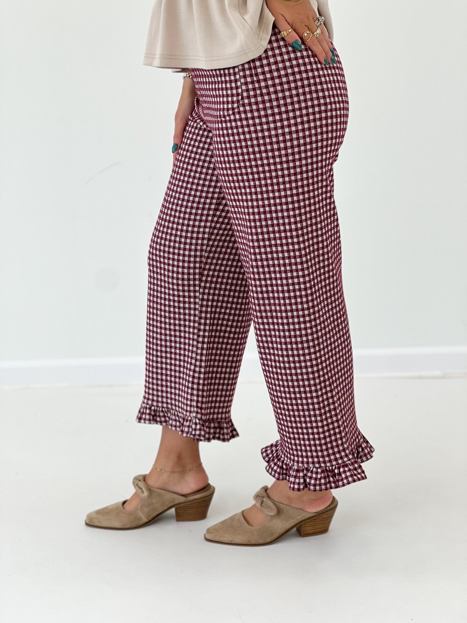 Printed gingham pants with a tiered ruffle at the leg opening