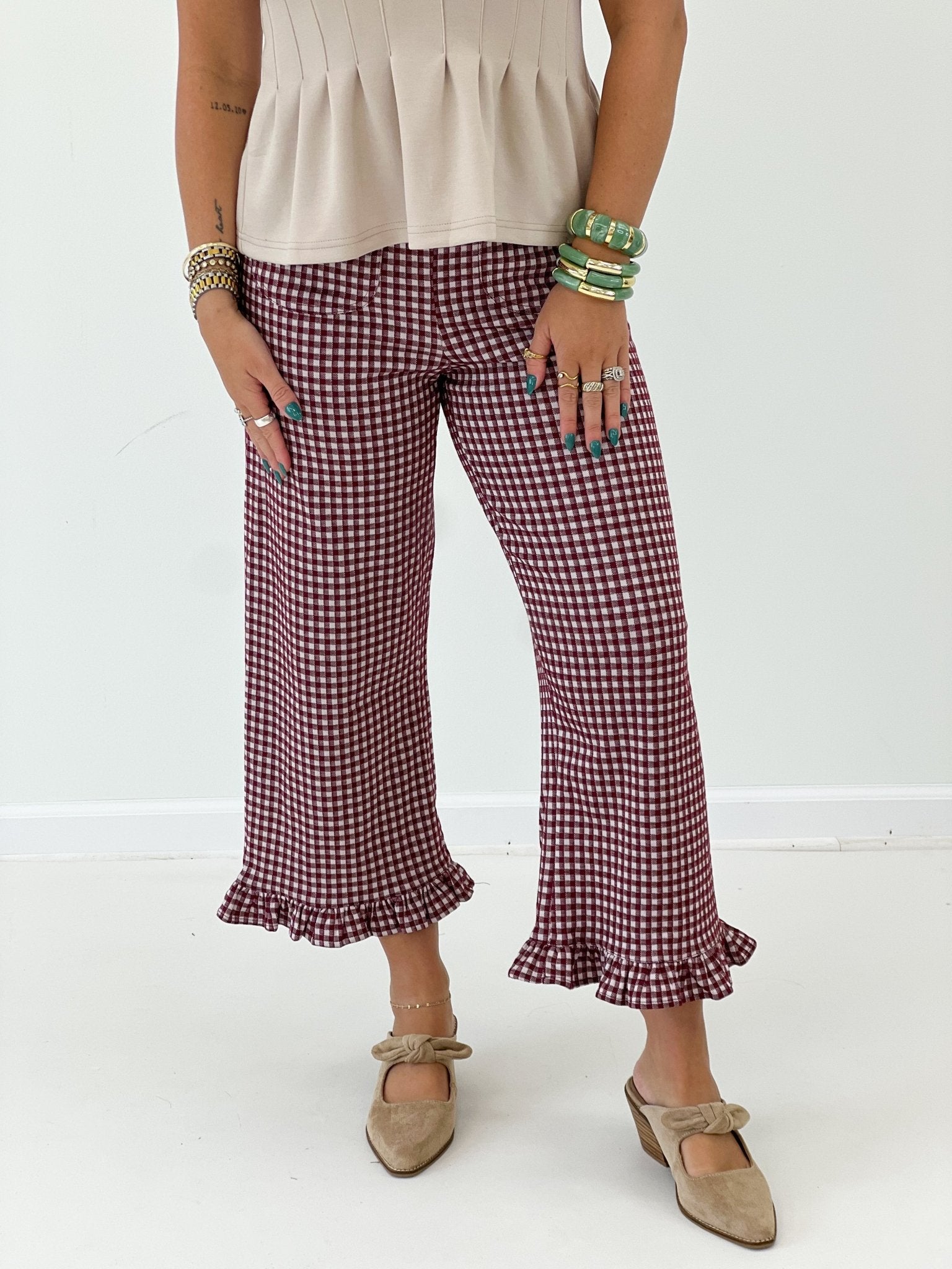 Check print pants with a soft ruffle bottom