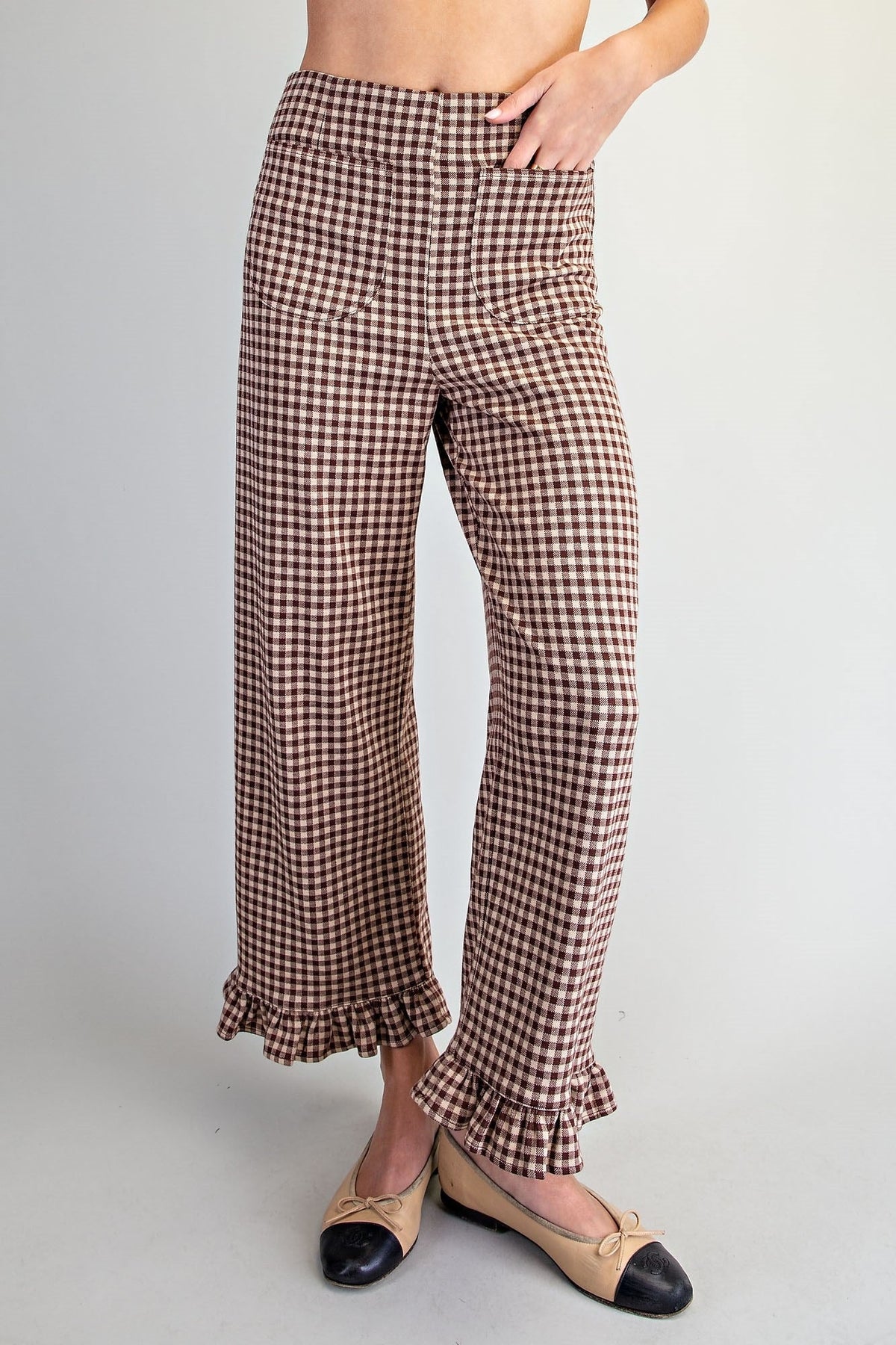 Brown check gingham pants with a flowing ruffle hem