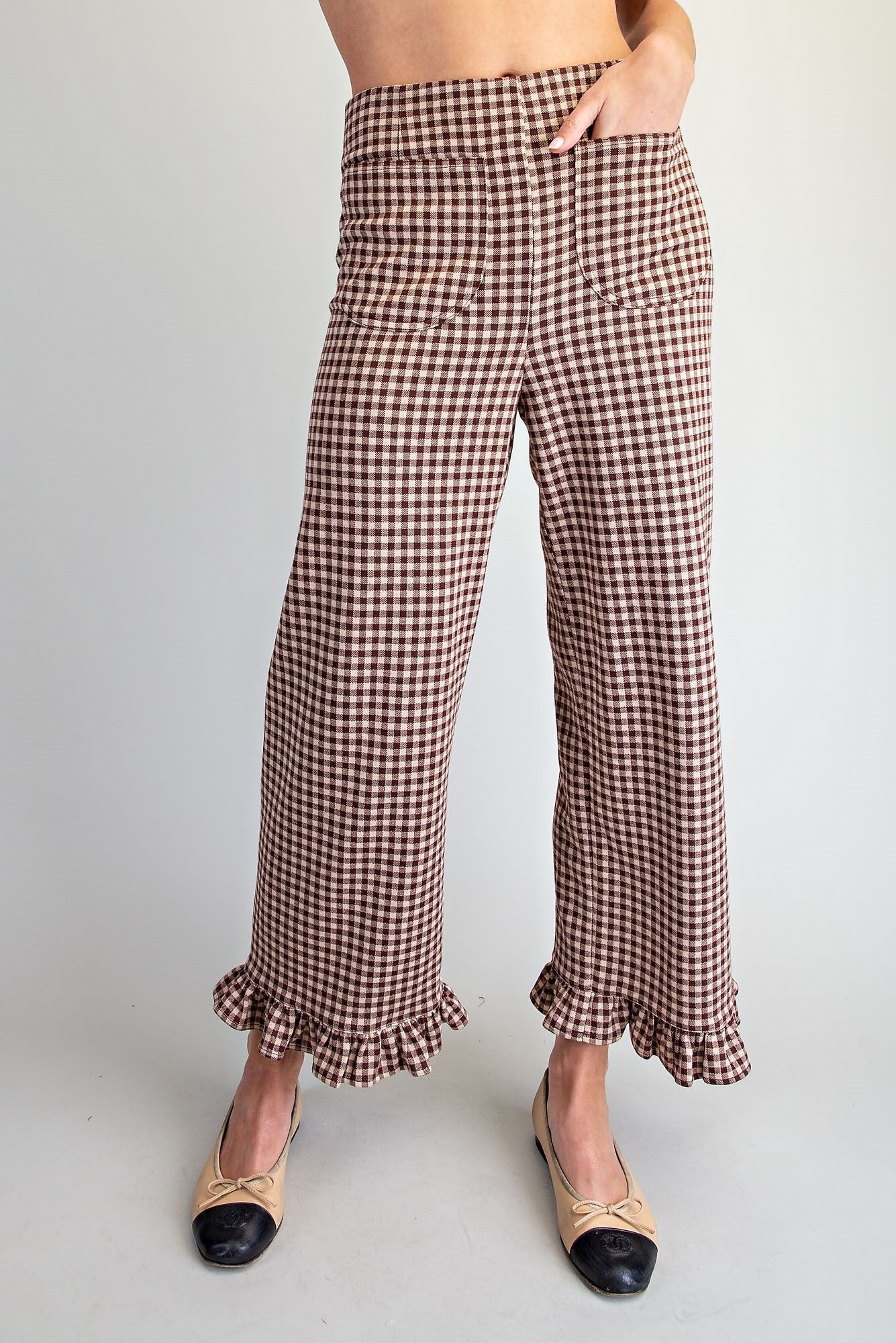Brown gingham check pants with ruffle detail at the leg opening