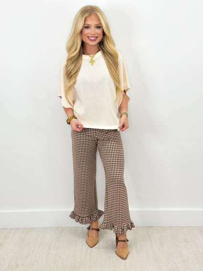Gingham check pants in brown with a soft ruffled hem