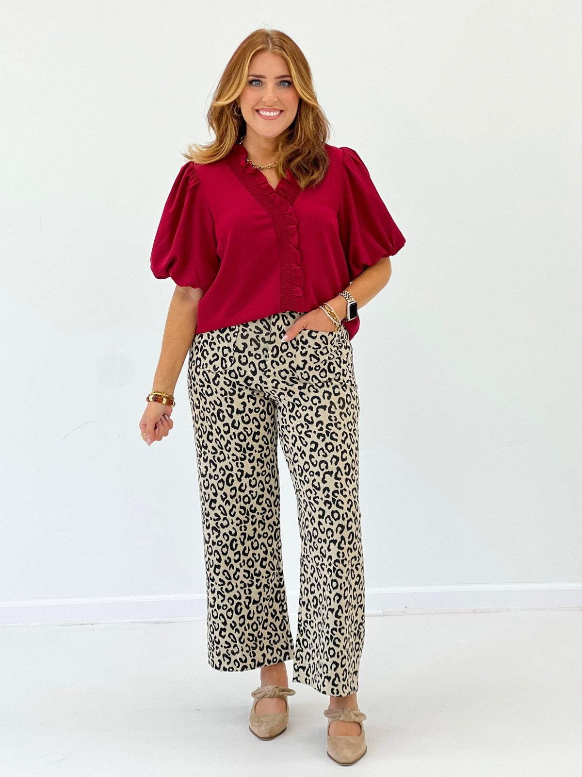 Leopard print pants in taupe with a zip front closure