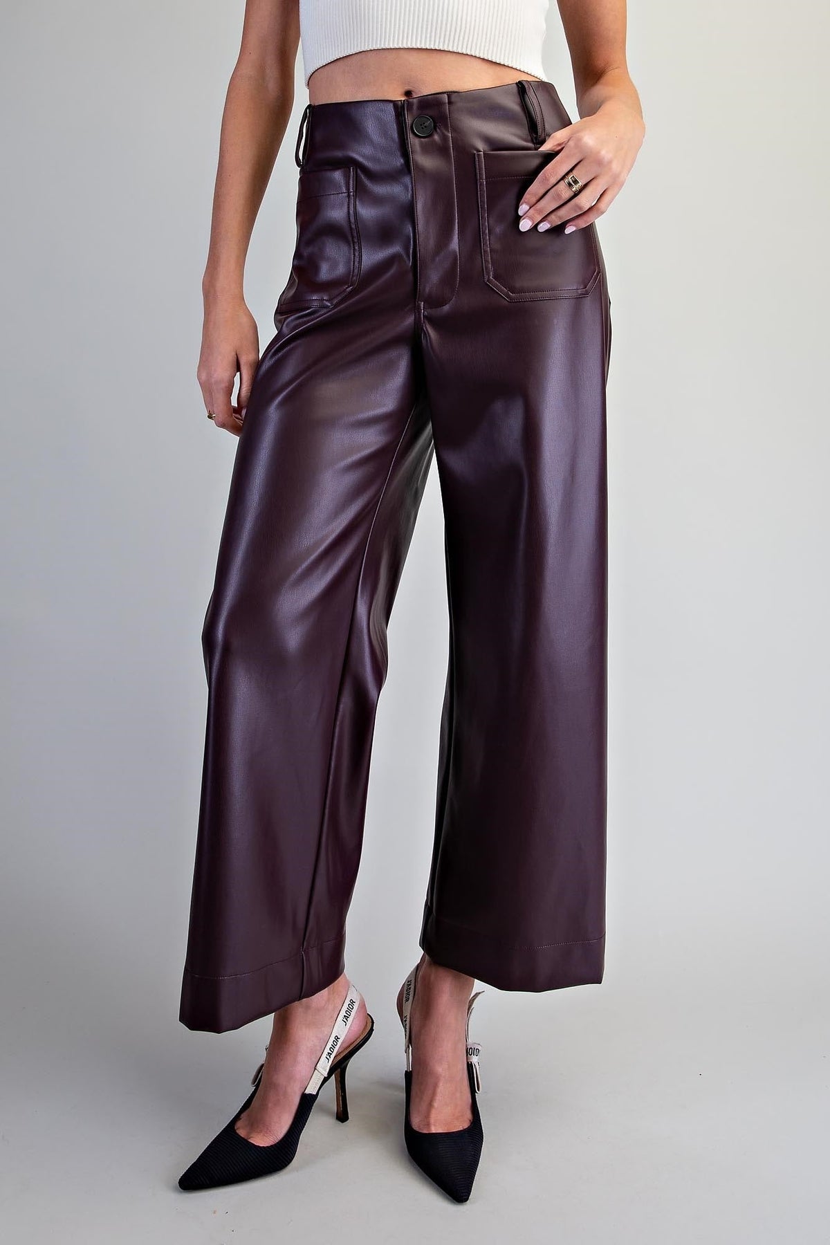 Black faux leather pants with utility style patch pockets