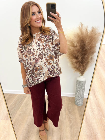 Floral print dolman top with a round neckline