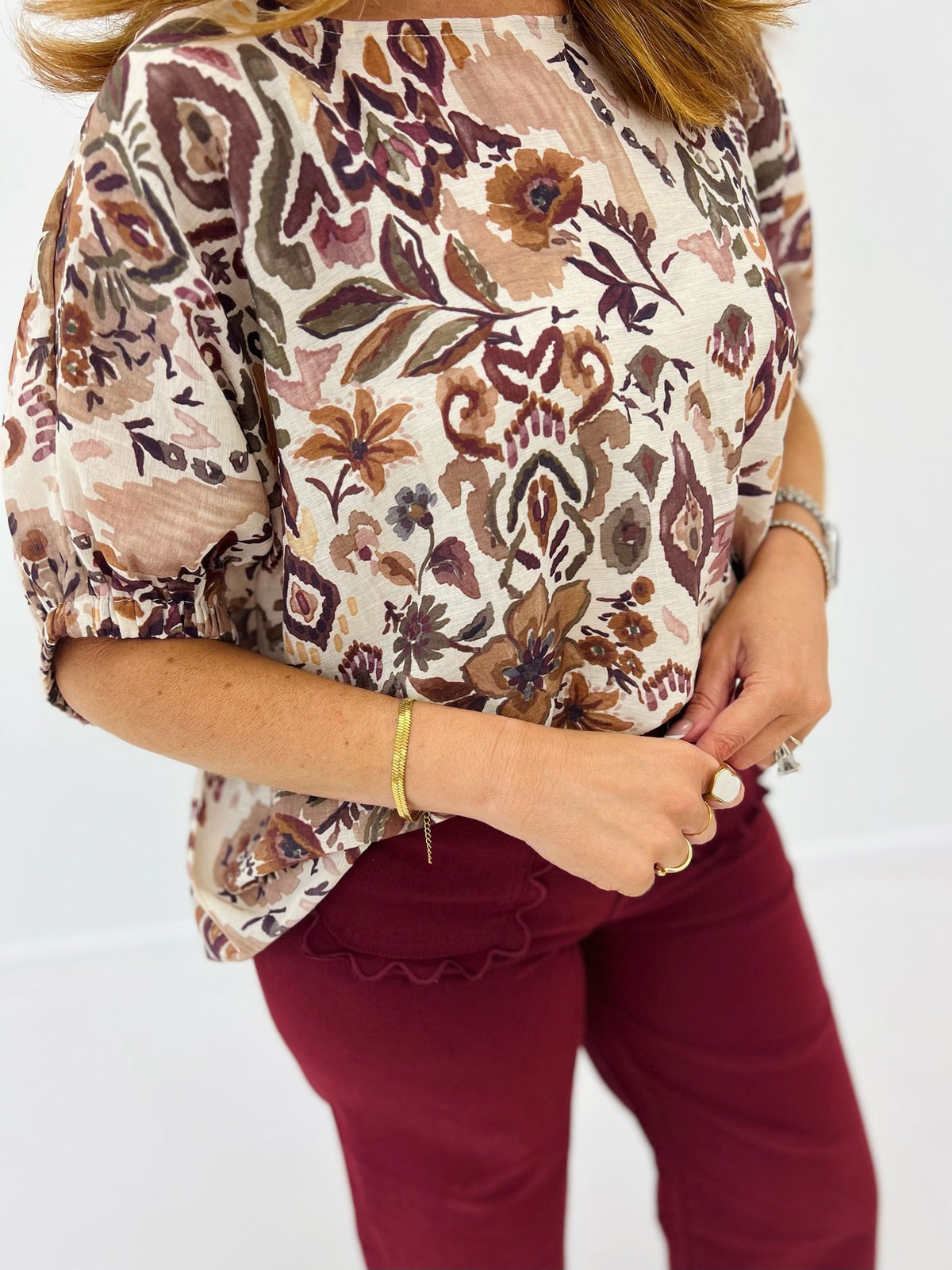 Dolman sleeve blouse with a garden floral print