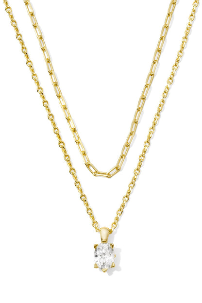 Multi-strand gold crystal necklace with white crystal flower pendant