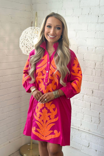 V-neckline on an embroidered long sleeve dress