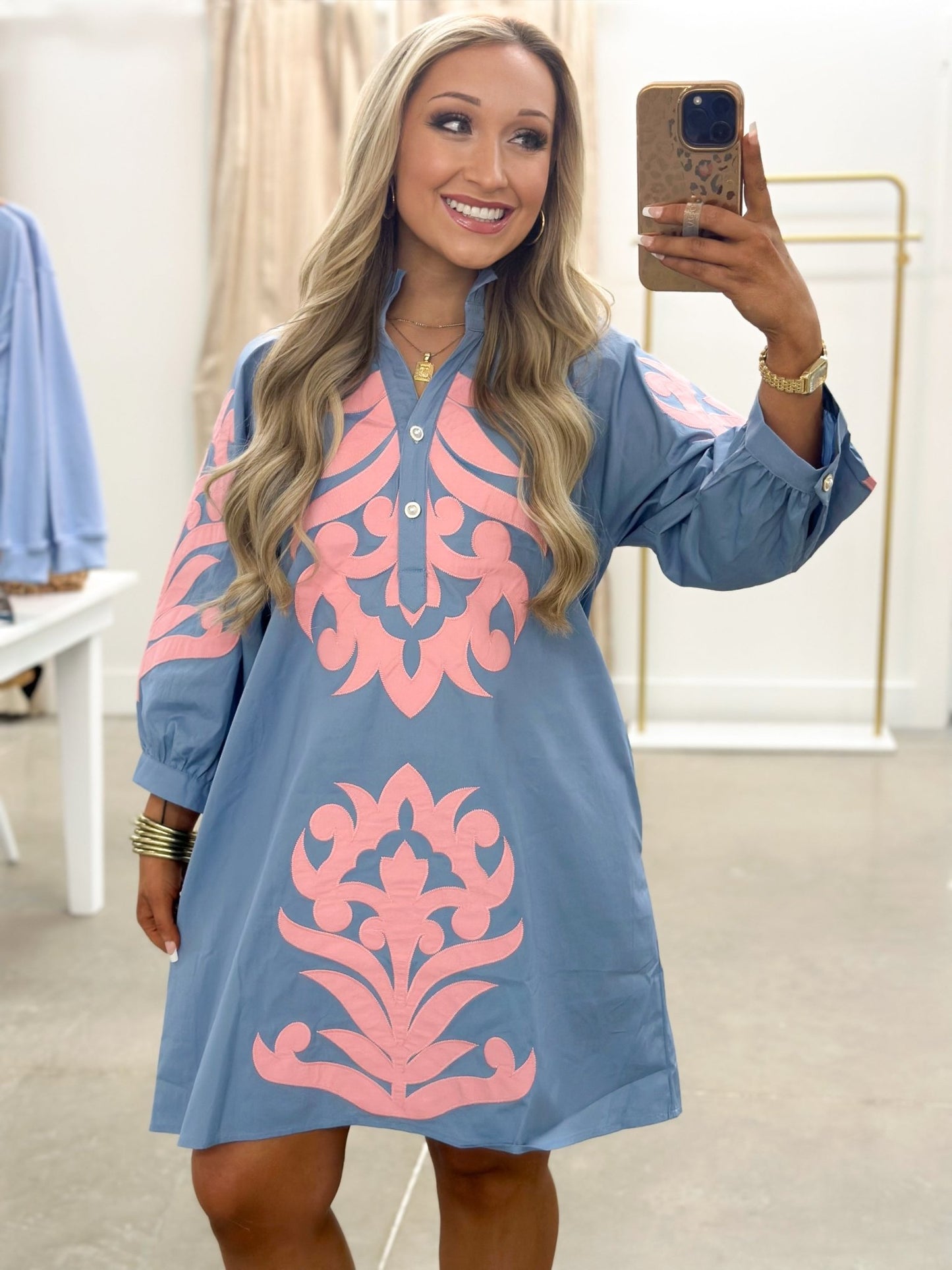 Stitched floral embroidery on a long sleeve dress