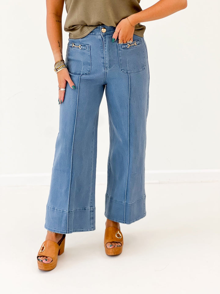 Wide leg pants with a metal bit hardware detail at the waist