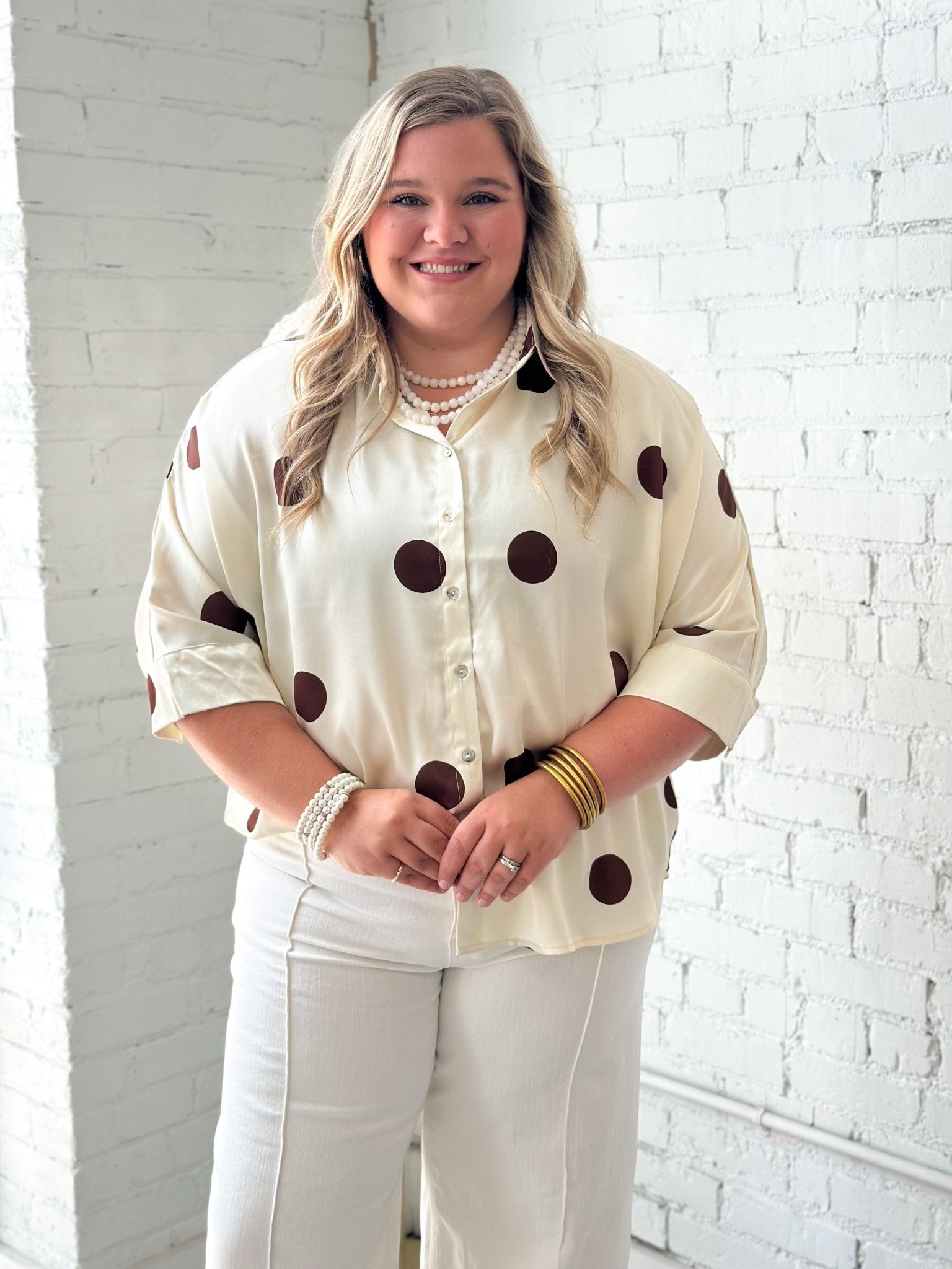 Button up top with an allover dot print
