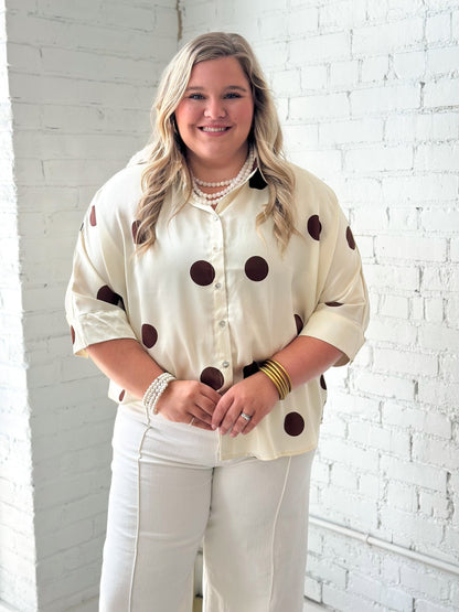 Button up top with an allover dot print