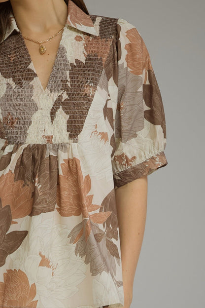 Floral mocha top with puff sleeves and a deep v-neck