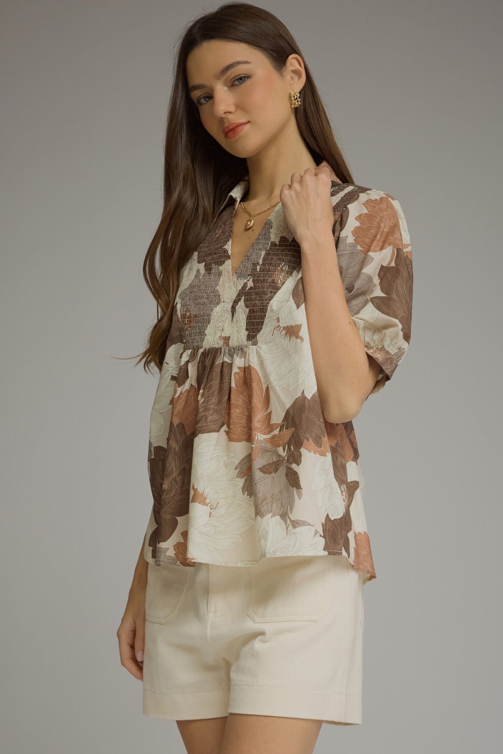 Floral print puff sleeve top in mocha with a smocked front