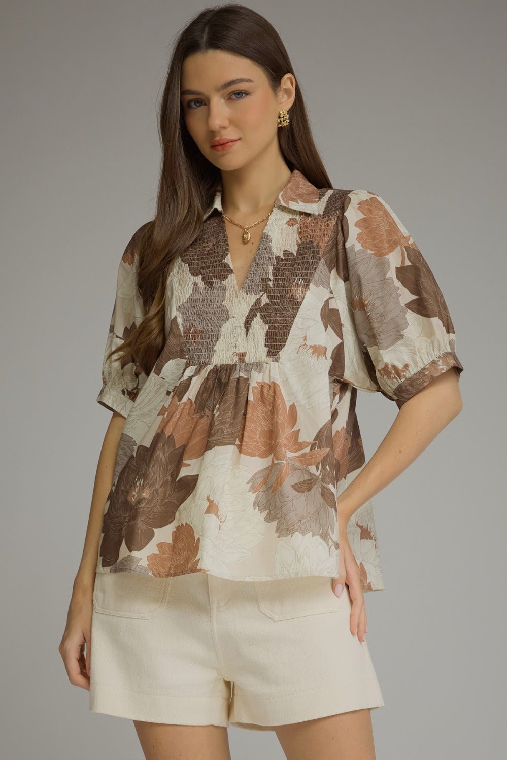 Mocha floral top with a smocked bodice and v-neckline