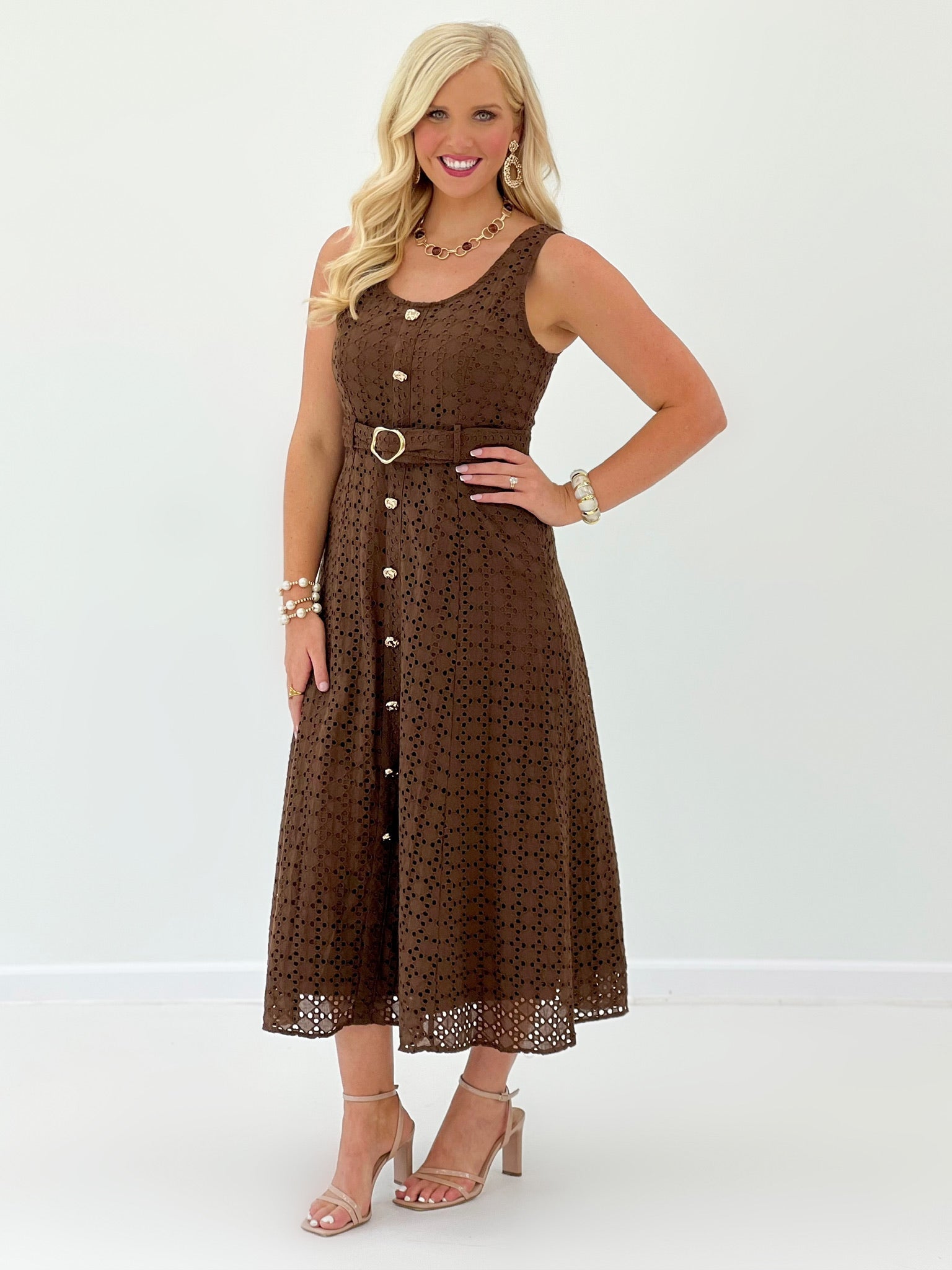 Belted eyelet dress in brown with a midi skirt