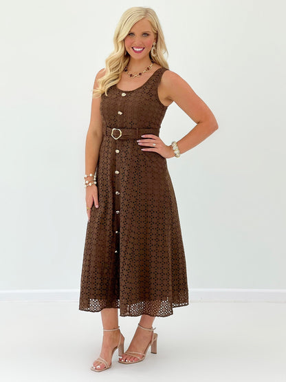 Belted eyelet dress in brown with a midi skirt