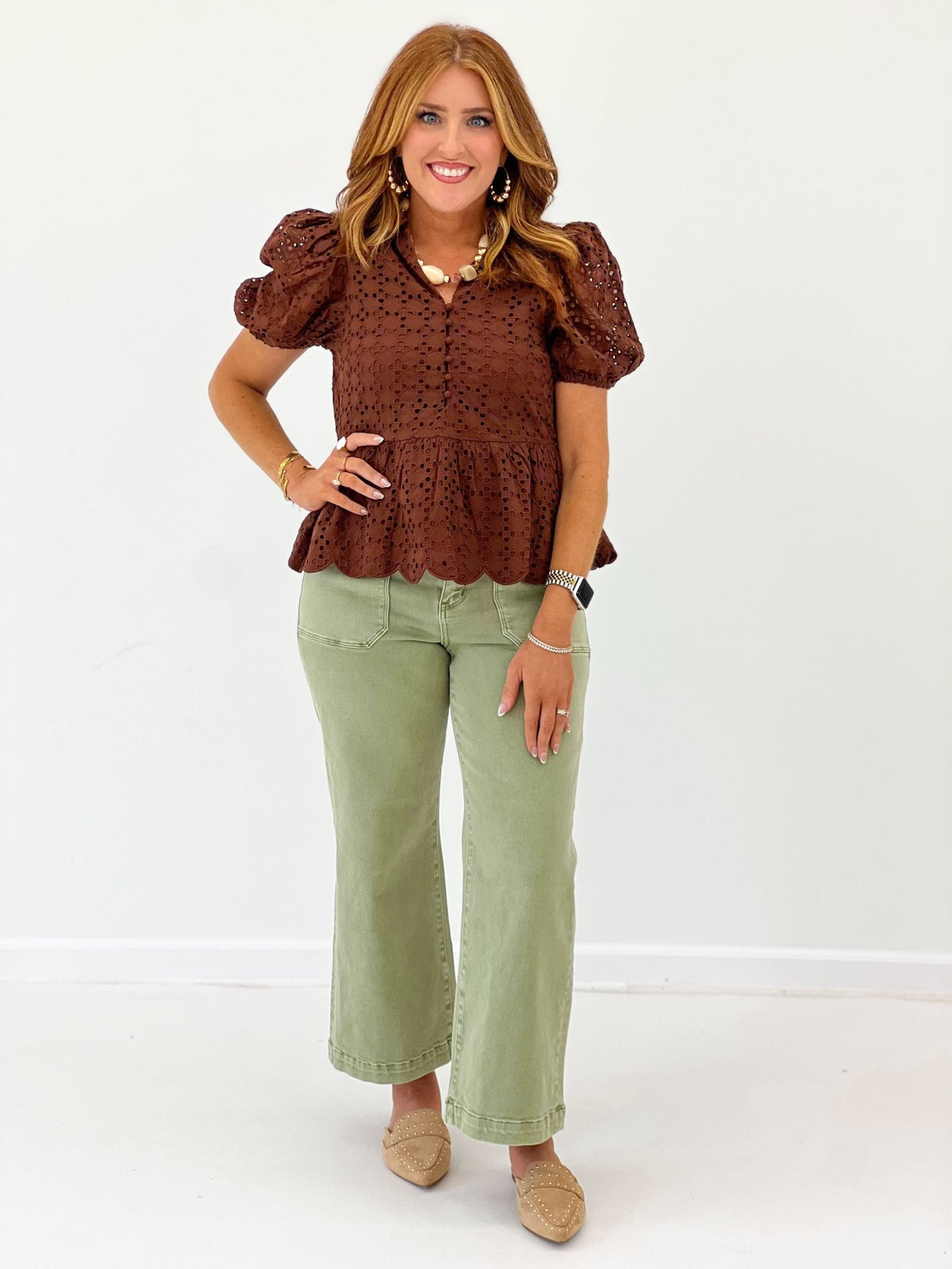 Ruffle neck top with openwork eyelet panels