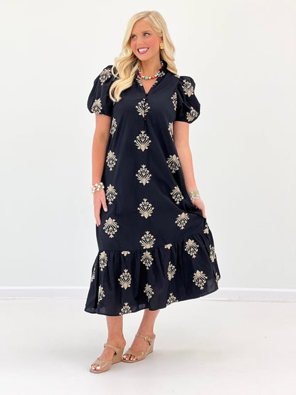 Floral stitching on the bodice of a puff sleeve dress