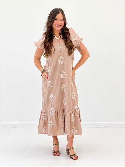 Embroidered puff sleeve dress with a round neckline
