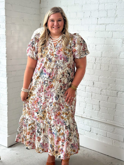 Ruffle collar and gold button detail on a floral eyelet midi dress