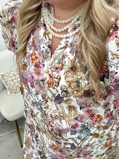 Floral print midi dress with puff sleeves and a ruffled collar