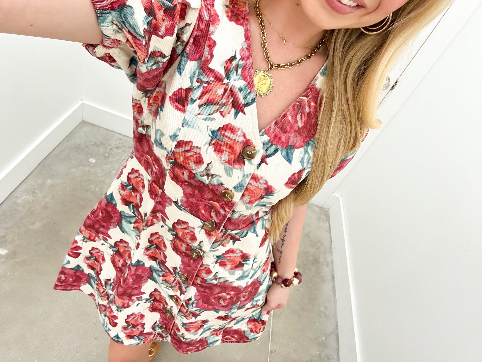 Ecru mini dress with a short hemline and floral print