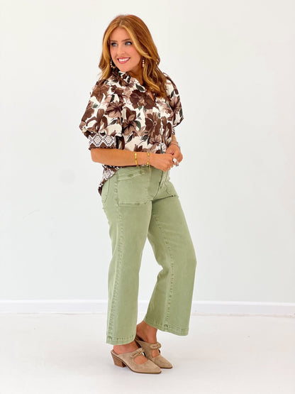 Printed brown blouse with a gathered ruffle neck