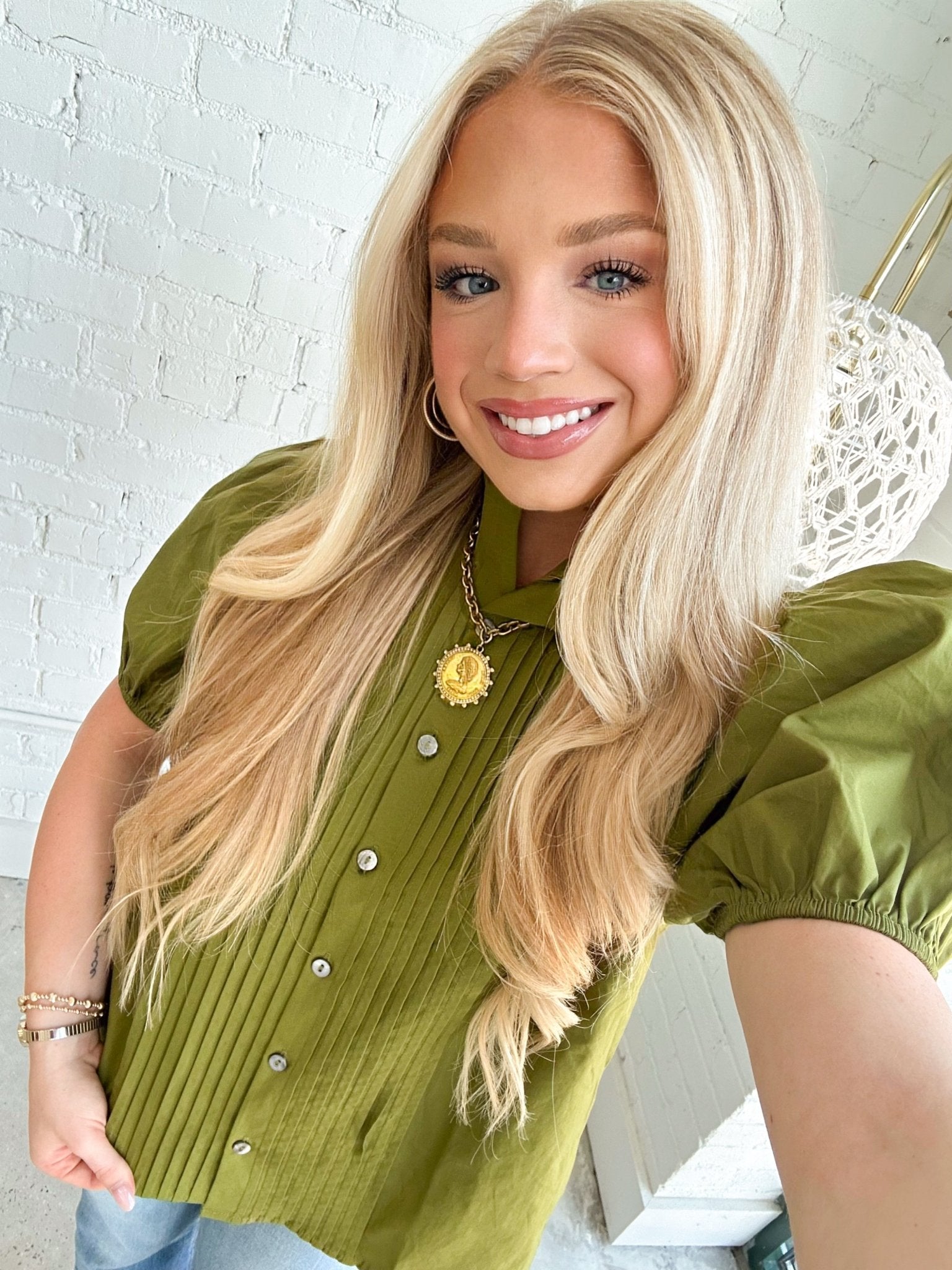 Puff sleeve top with a soft pleated bodice