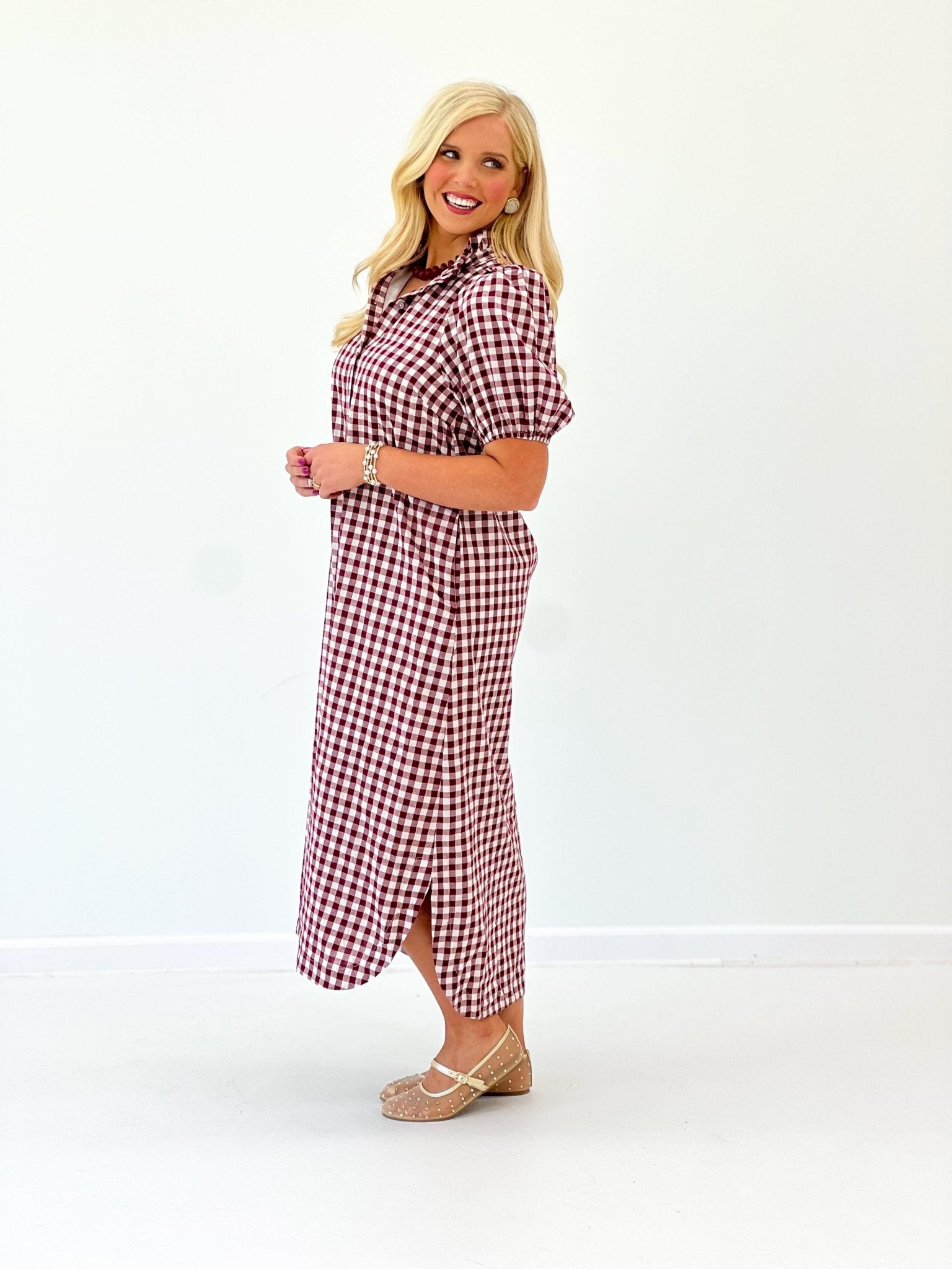 Button placket on a wine gingham dress