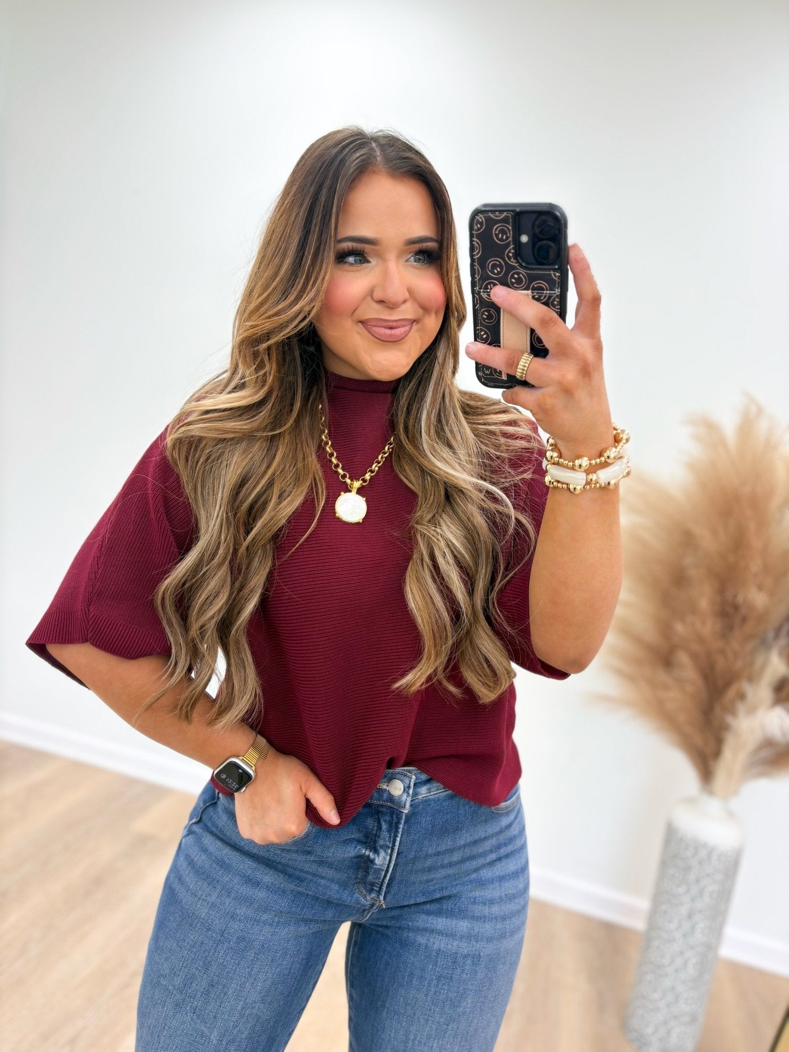 Short sleeve mock neck knit with a fitted body