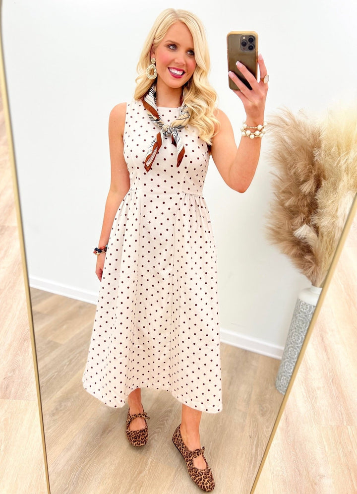 Ecru and brown polka dot sleeveless dress with pleated detail