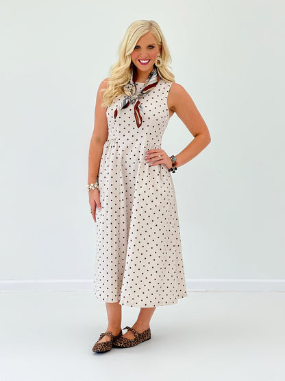 Polka dot dress with pleating and no sleeves