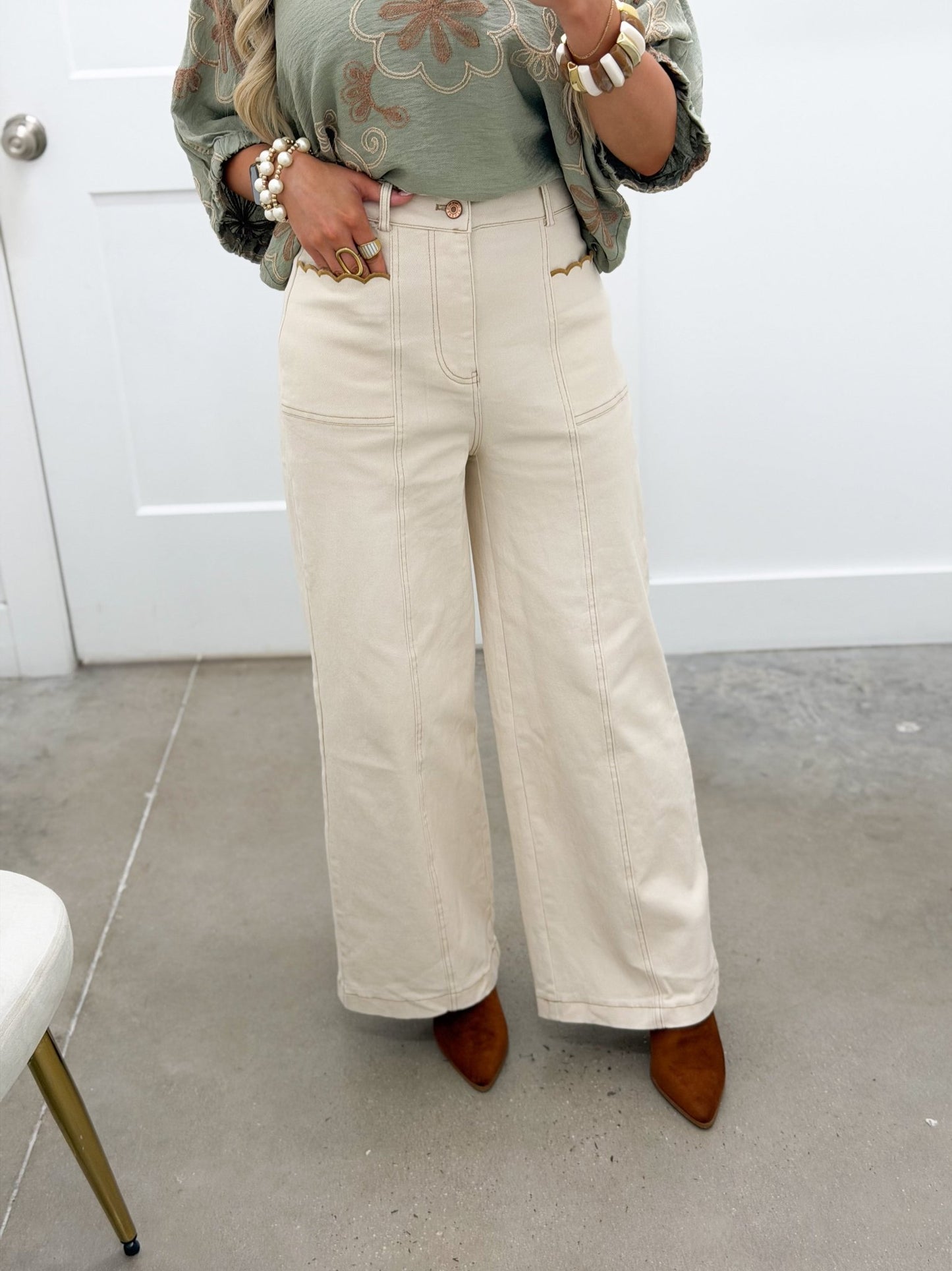 Ecru straight leg pants with scalloped pockets