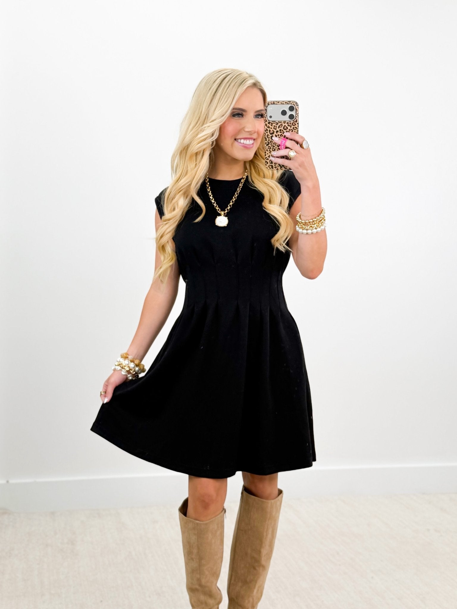 Pintuck seam detail on a sleeveless scuba dress