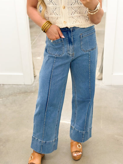 Denim trousers with a centre front seam and clean waistband