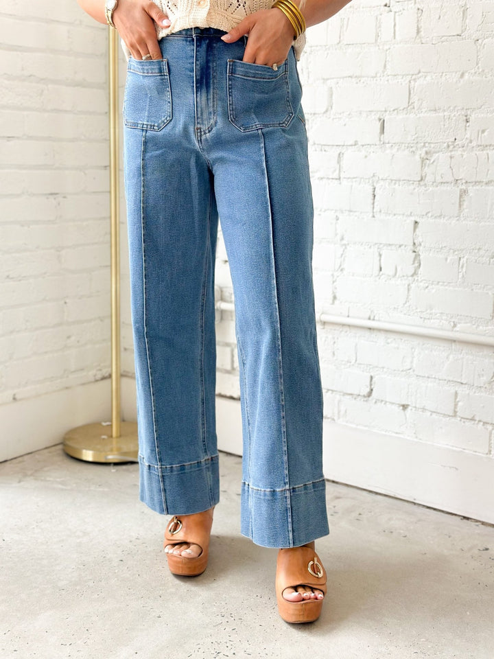 Denim pants with a pressed front seam down each leg