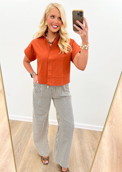 Solid rust blouse with a stand collar