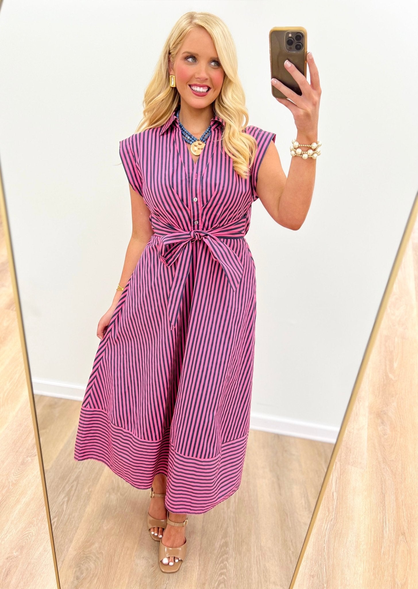Sleeveless striped midi dress with a defined waist