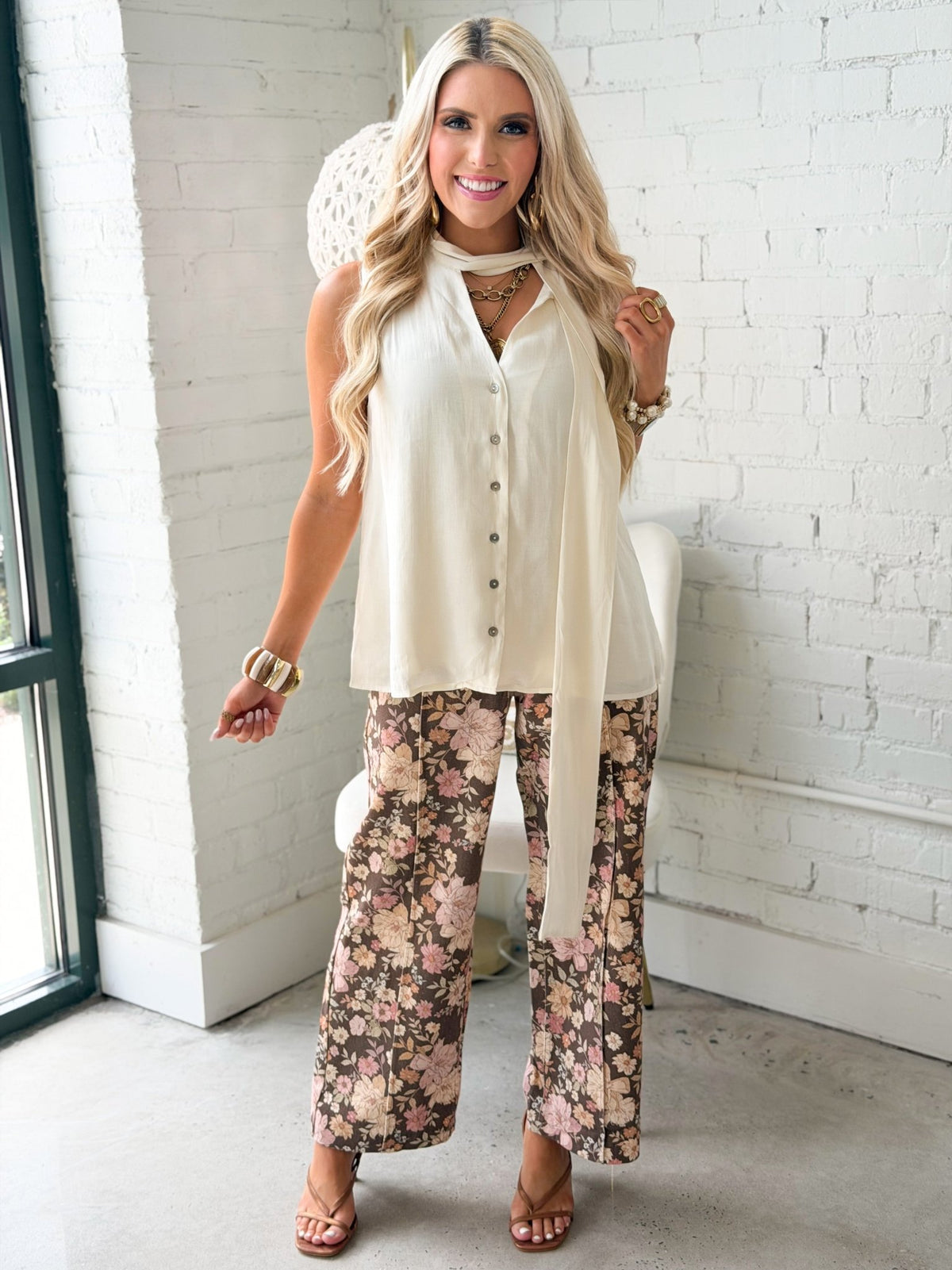 Solid sleeveless blouse with a self tie