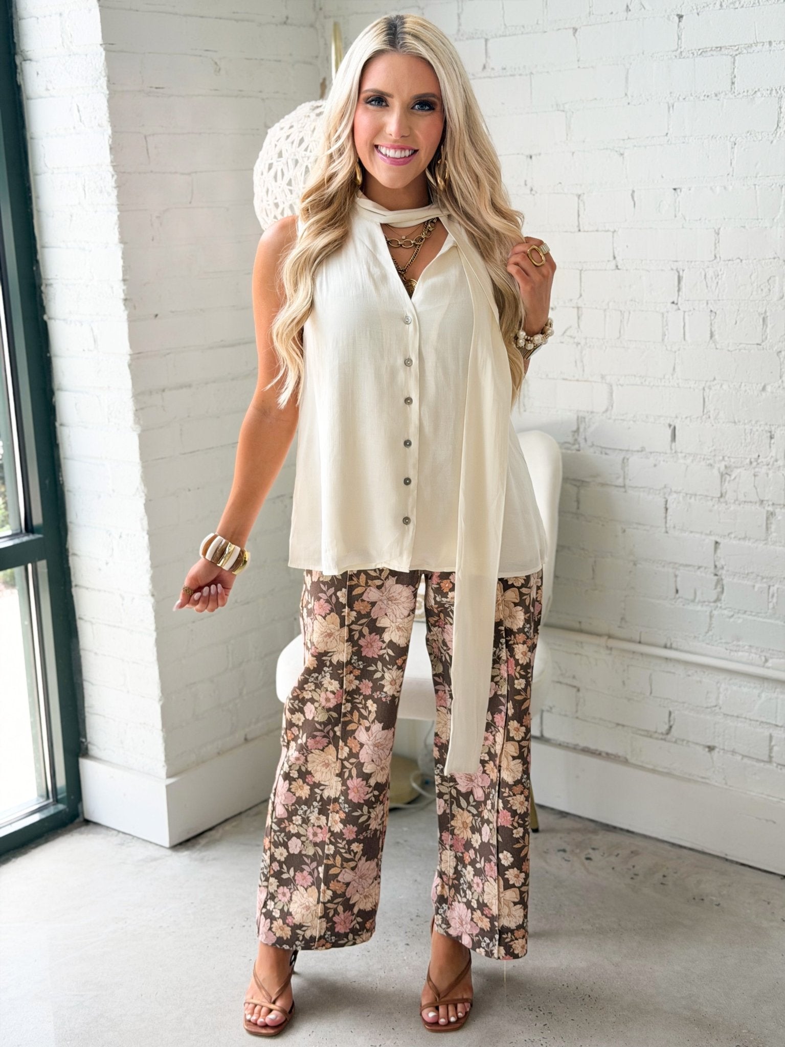 Solid sleeveless blouse with a self tie