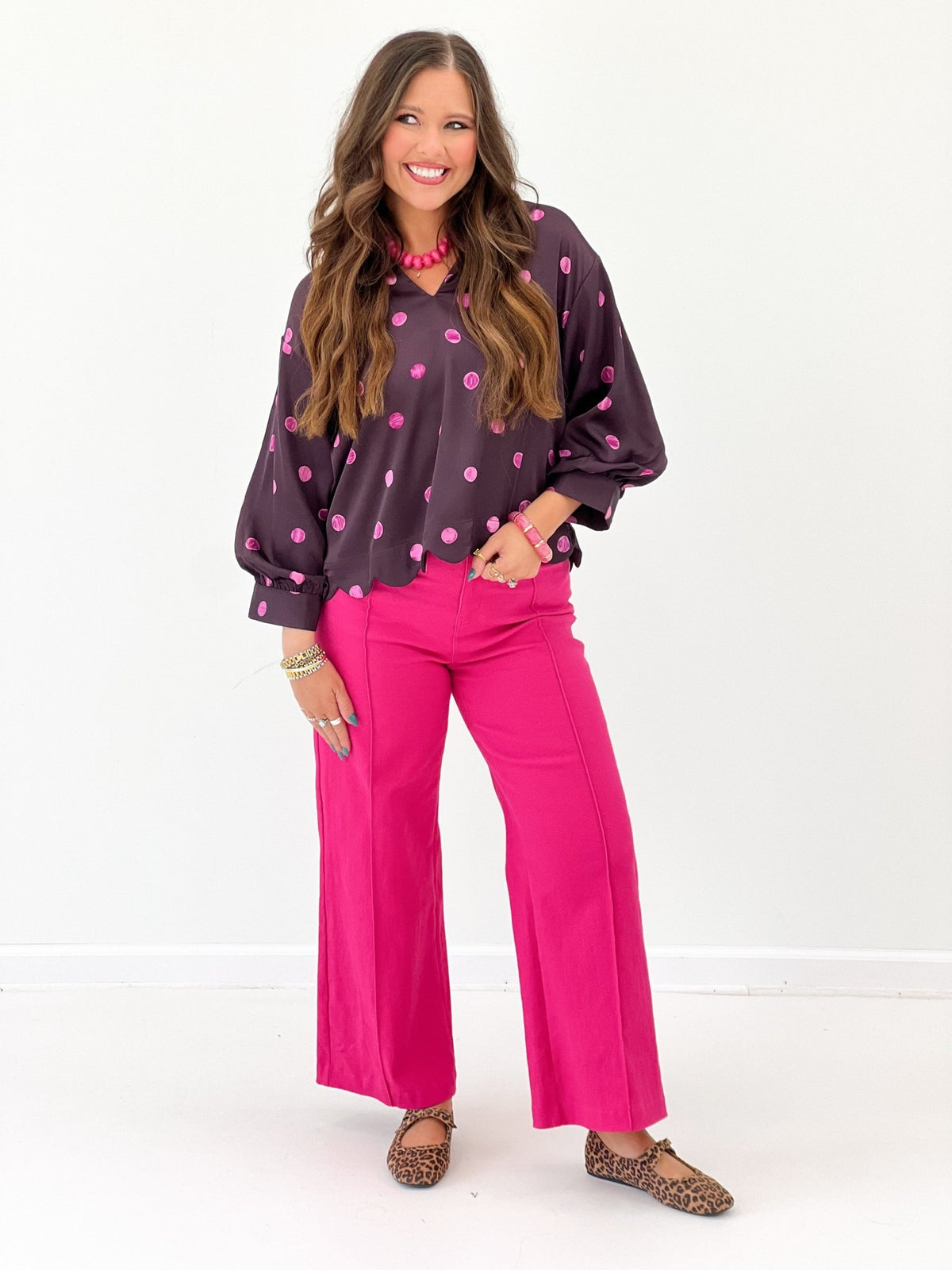 V-neck polka dot top in a plum shade