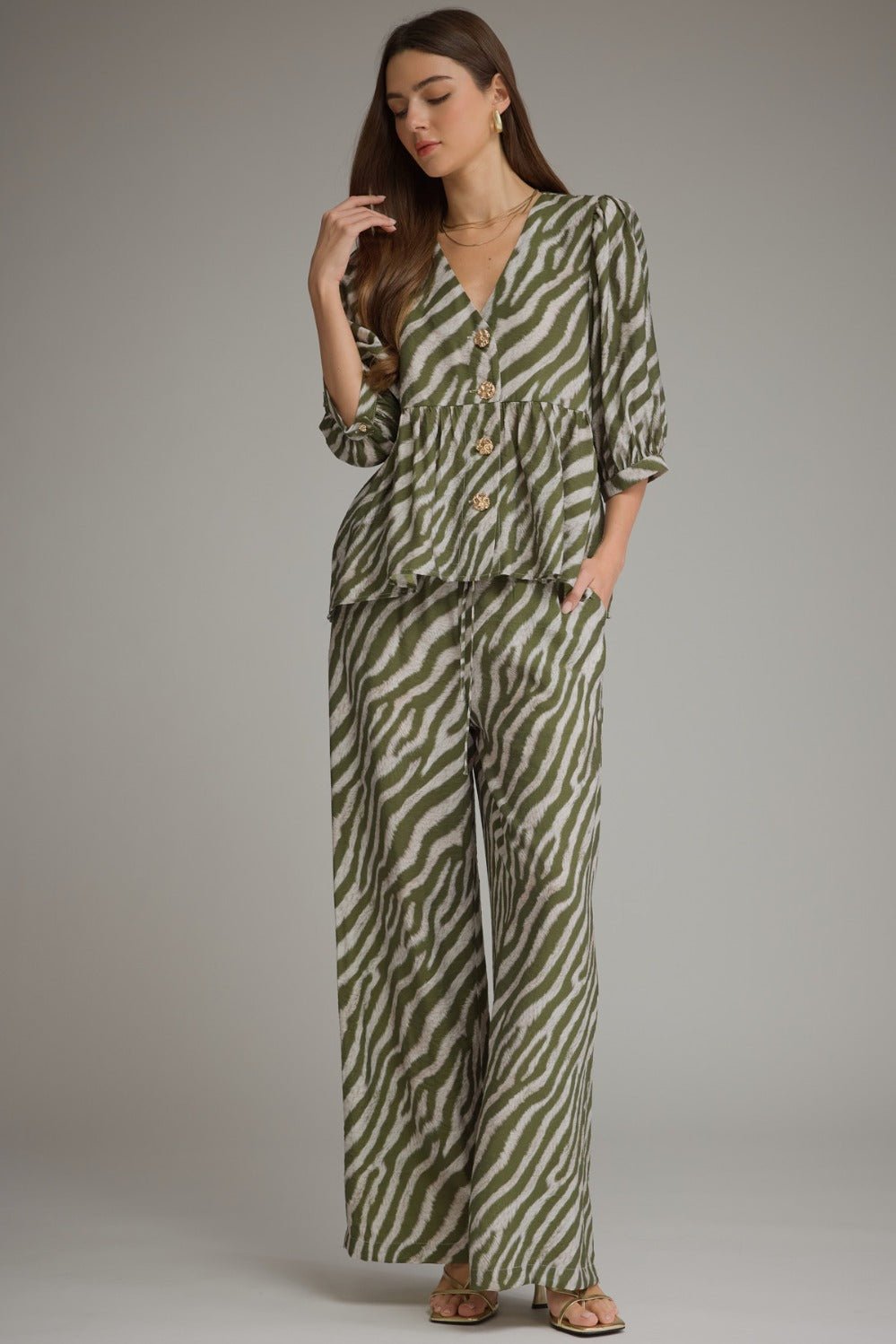 Olive zebra print blouse with a relaxed puff sleeve