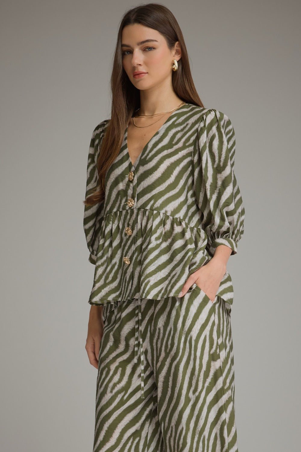 Zebra print top in olive with a full button placket