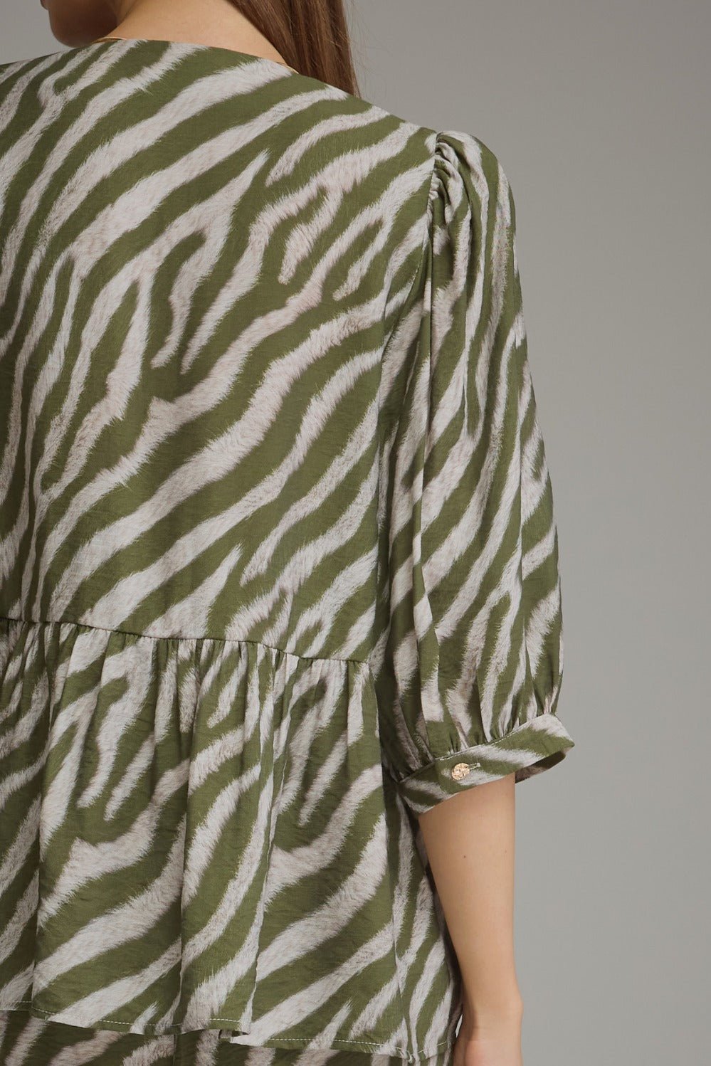 Puff sleeve zebra print top in olive with a collarless neckline