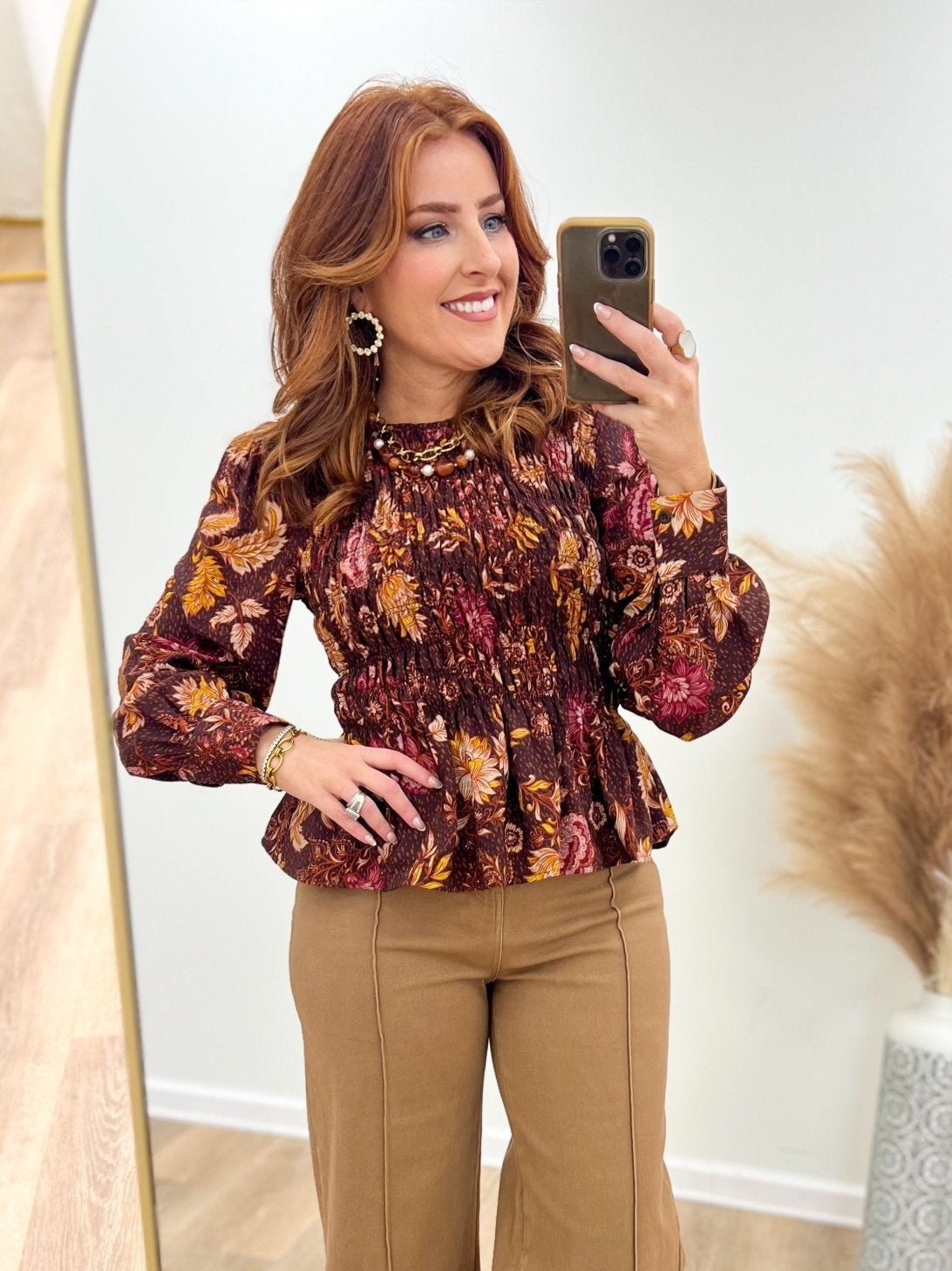 Dark floral top with a stretchy smocked upper